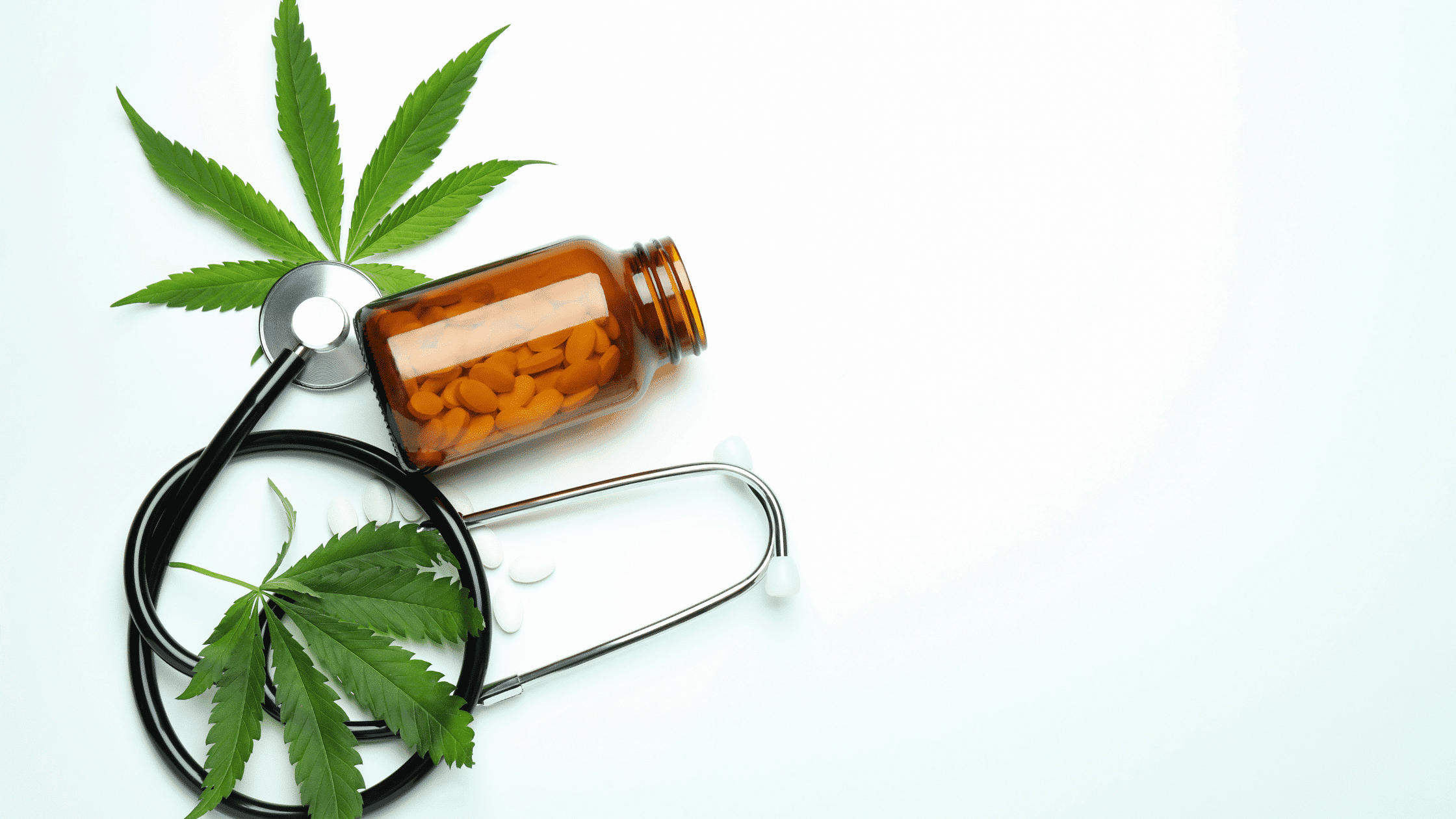 Medical cannabis concept with a stethoscope, cannabis leaves, and pill bottle representing cannabis for pain relief